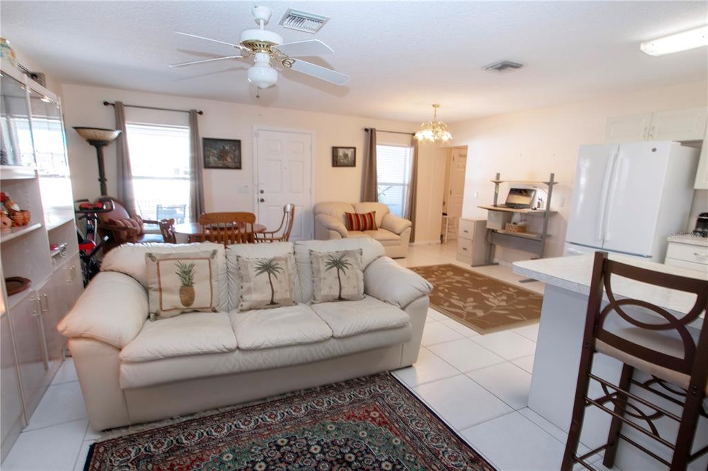 4010 North Lockwood Ridge Road Sarasota, FL 34235 - Photo 34 of 64 a living room with furniture and a large window