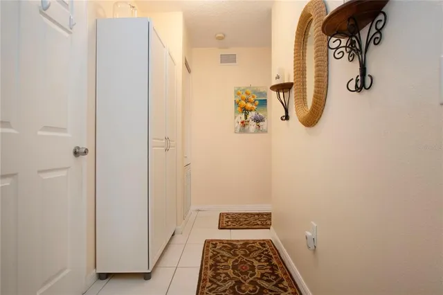 a room with a fireplace and a chandelier