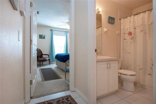 a living room with furniture and a piano
