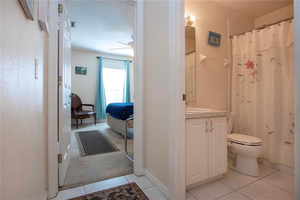 4010 North Lockwood Ridge Road Sarasota, FL 34235 - Photo 36 of 64 a bathroom with a sink toilet and shower