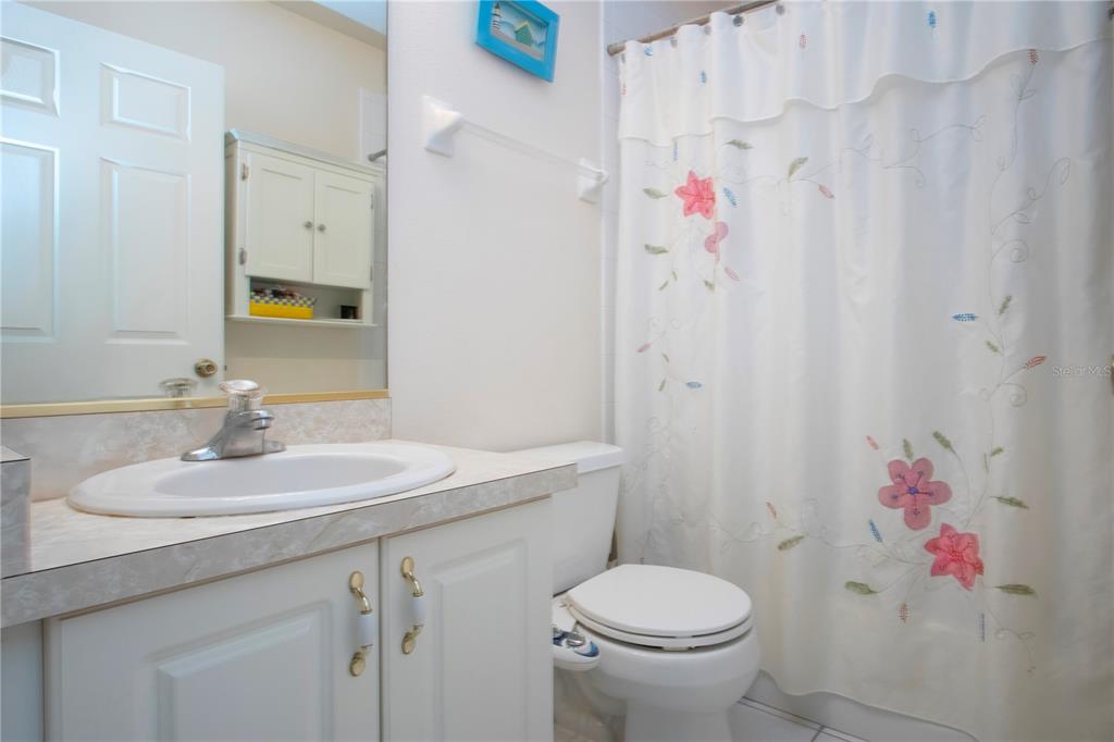4010 North Lockwood Ridge Road Sarasota, FL 34235 - Photo 42 of 64 a bathroom with a sink toilet and shower