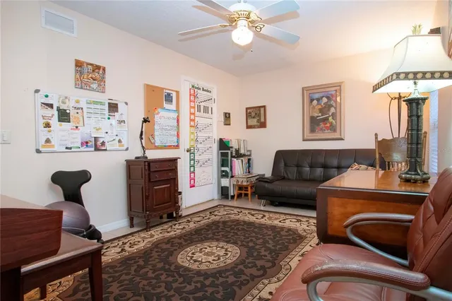 a view of a house with yard and sitting area