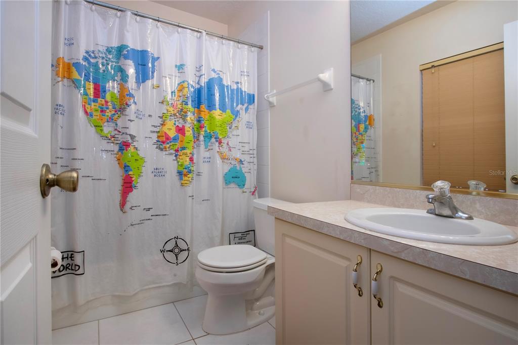 4010 North Lockwood Ridge Road Sarasota, FL 34235 - Photo 54 of 64 a bathroom with a sink mirror vanity and toilet