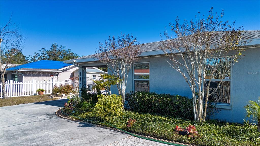 4010 North Lockwood Ridge Road Sarasota, FL 34235 - Photo 57 of 64 a front view of a house with garden