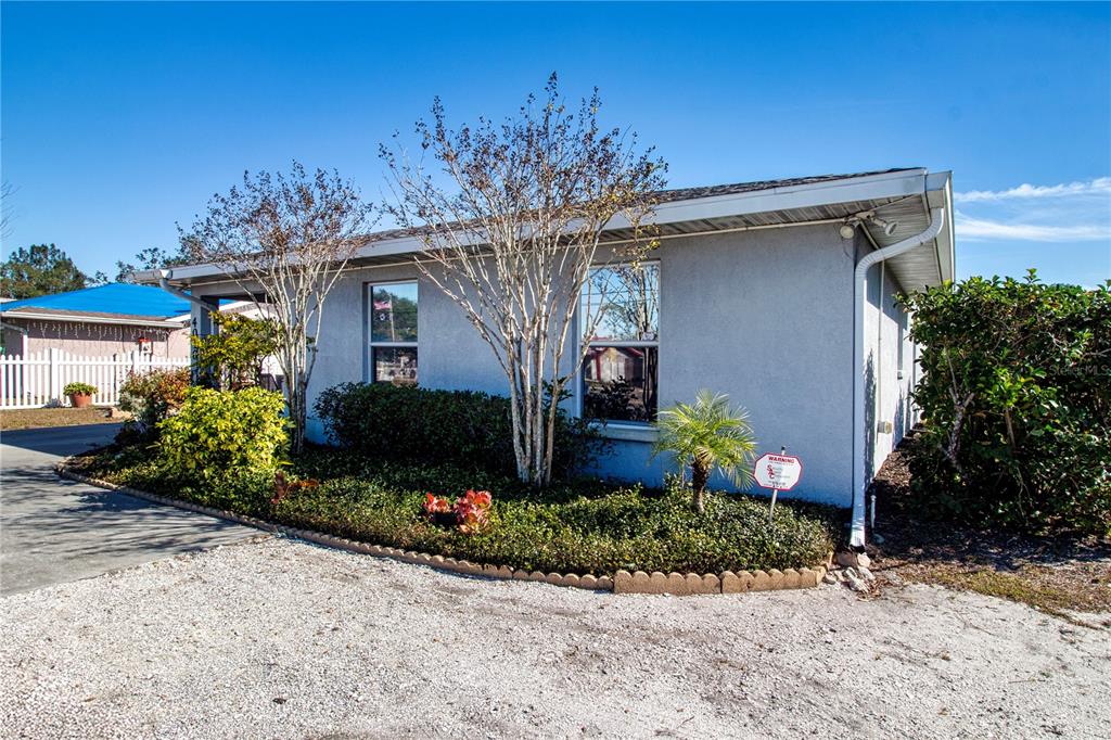 4010 North Lockwood Ridge Road Sarasota, FL 34235 - Photo 58 of 64 a front view of a house with a yard