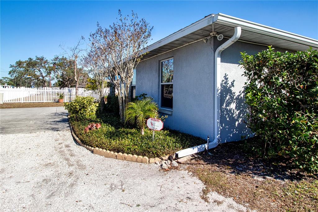 4010 North Lockwood Ridge Road Sarasota, FL 34235 - Photo 59 of 64 a front view of a house with a yard