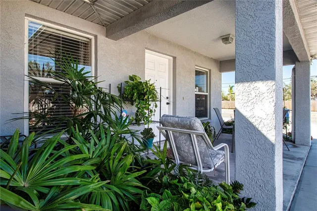 a kitchen with stainless steel appliances granite countertop a refrigerator sink and white cabinets