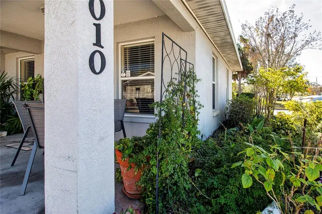 a living room with furniture a dining table and kitchen view
