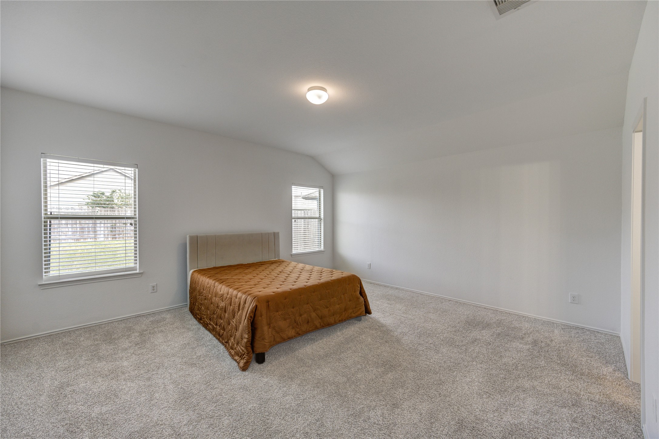 2010 Louetta Stream Way Spring, TX 77388 - Photo 16 of 47 a spacious bedroom with a bed and window