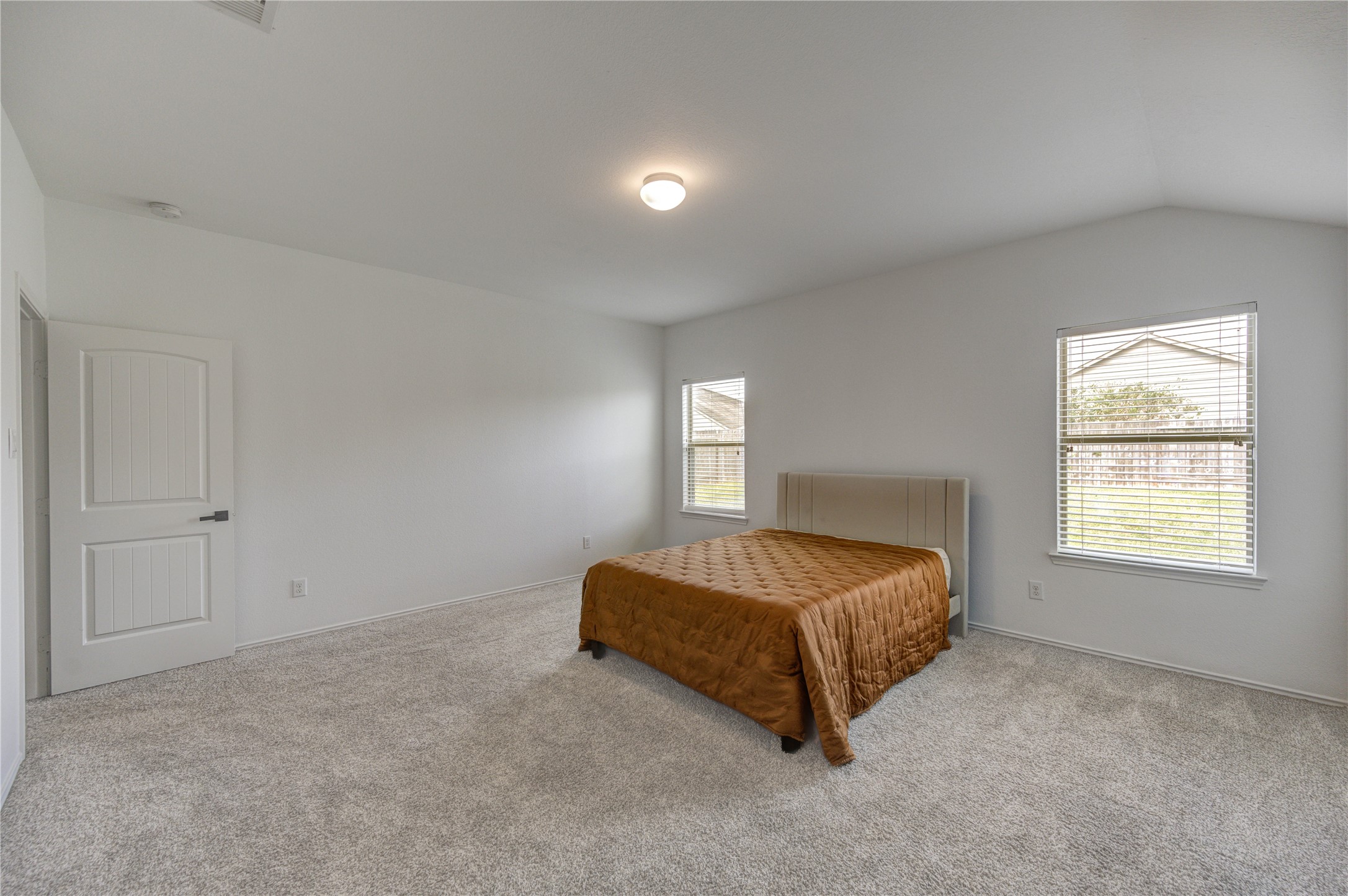 2010 Louetta Stream Way Spring, TX 77388 - Photo 18 of 47 a spacious bedroom with a bed and window