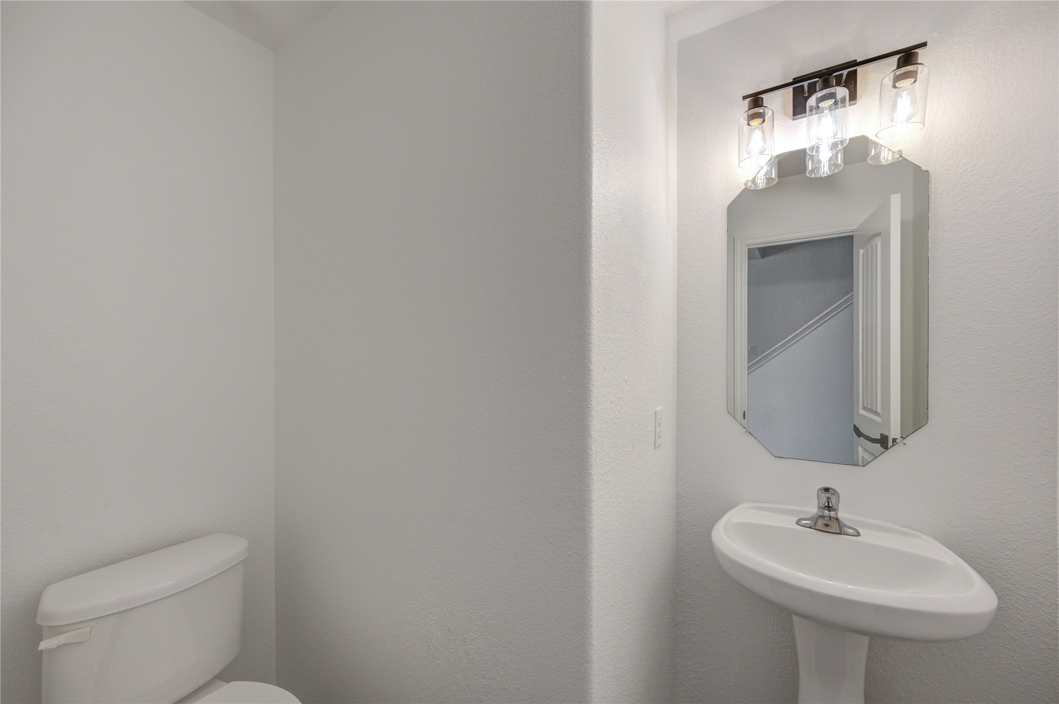 2010 Louetta Stream Way Spring, TX 77388 - Photo 25 of 47 a bathroom with a toilet sink and mirror
