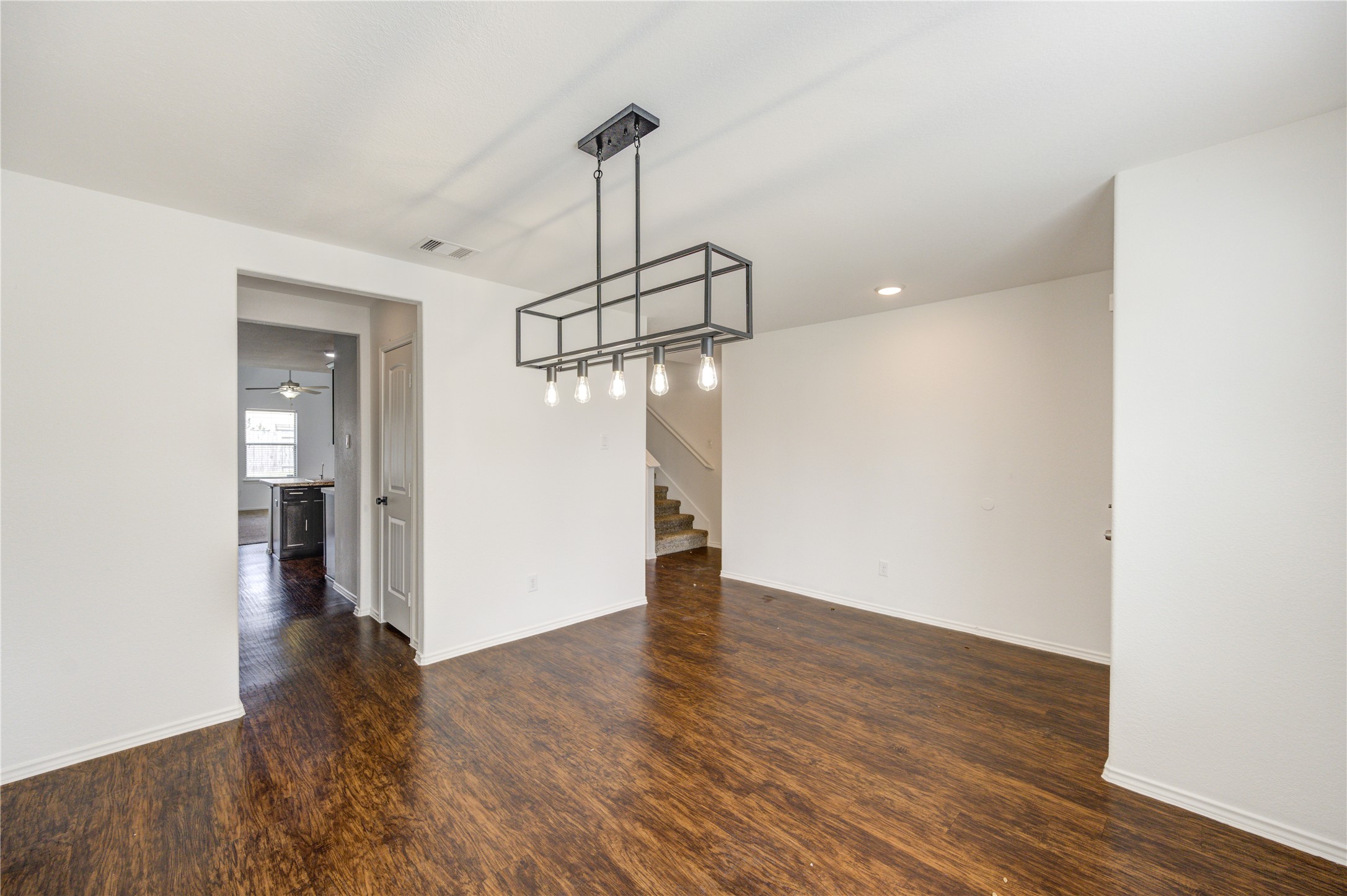 2010 Louetta Stream Way Spring, TX 77388 - Photo 3 of 47 a view of a room with wooden floor staircase and a hallway