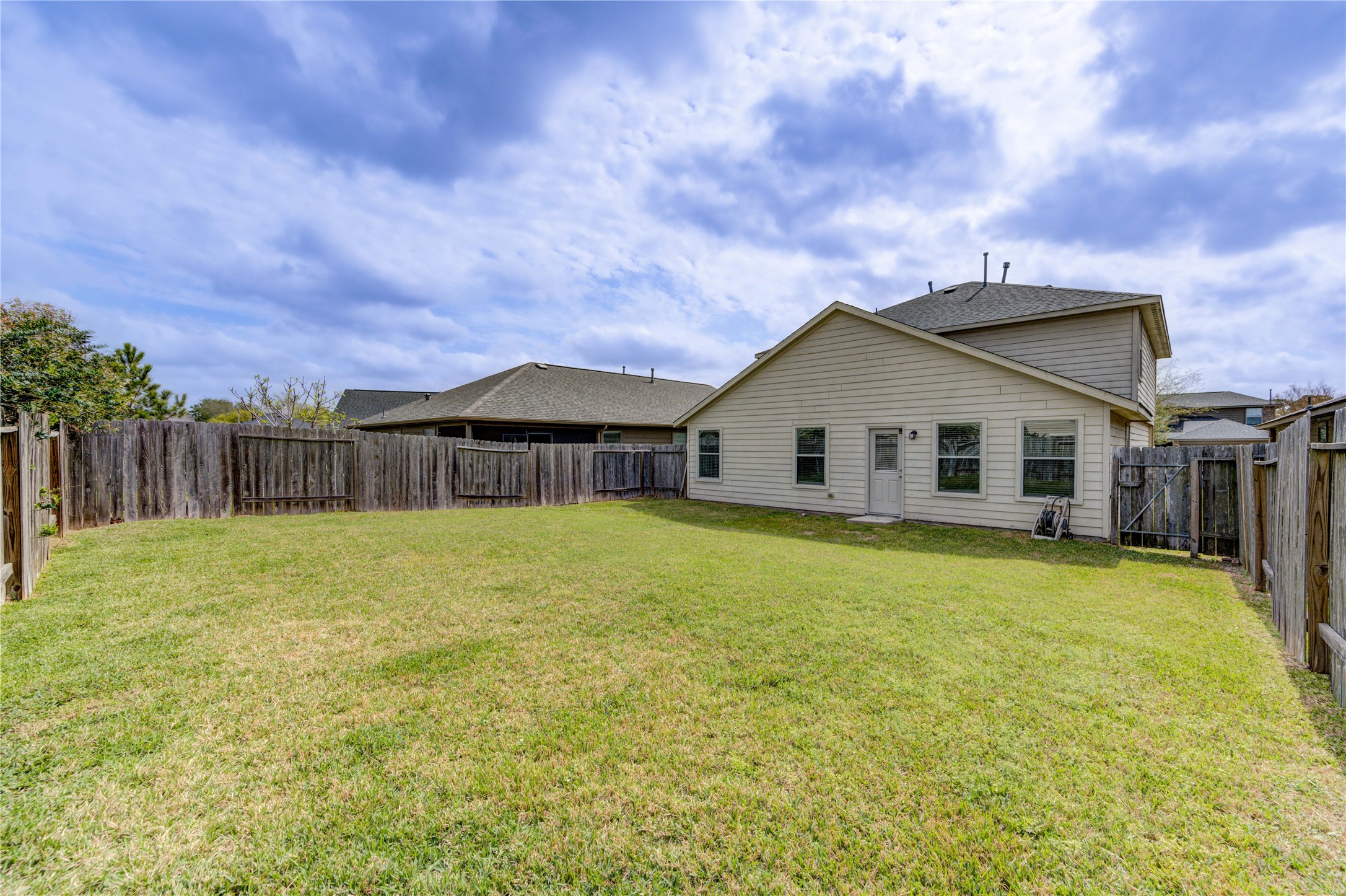 2010 Louetta Stream Way Spring, TX 77388 - Photo 39 of 47 a view of a house with backyard and wooden fence