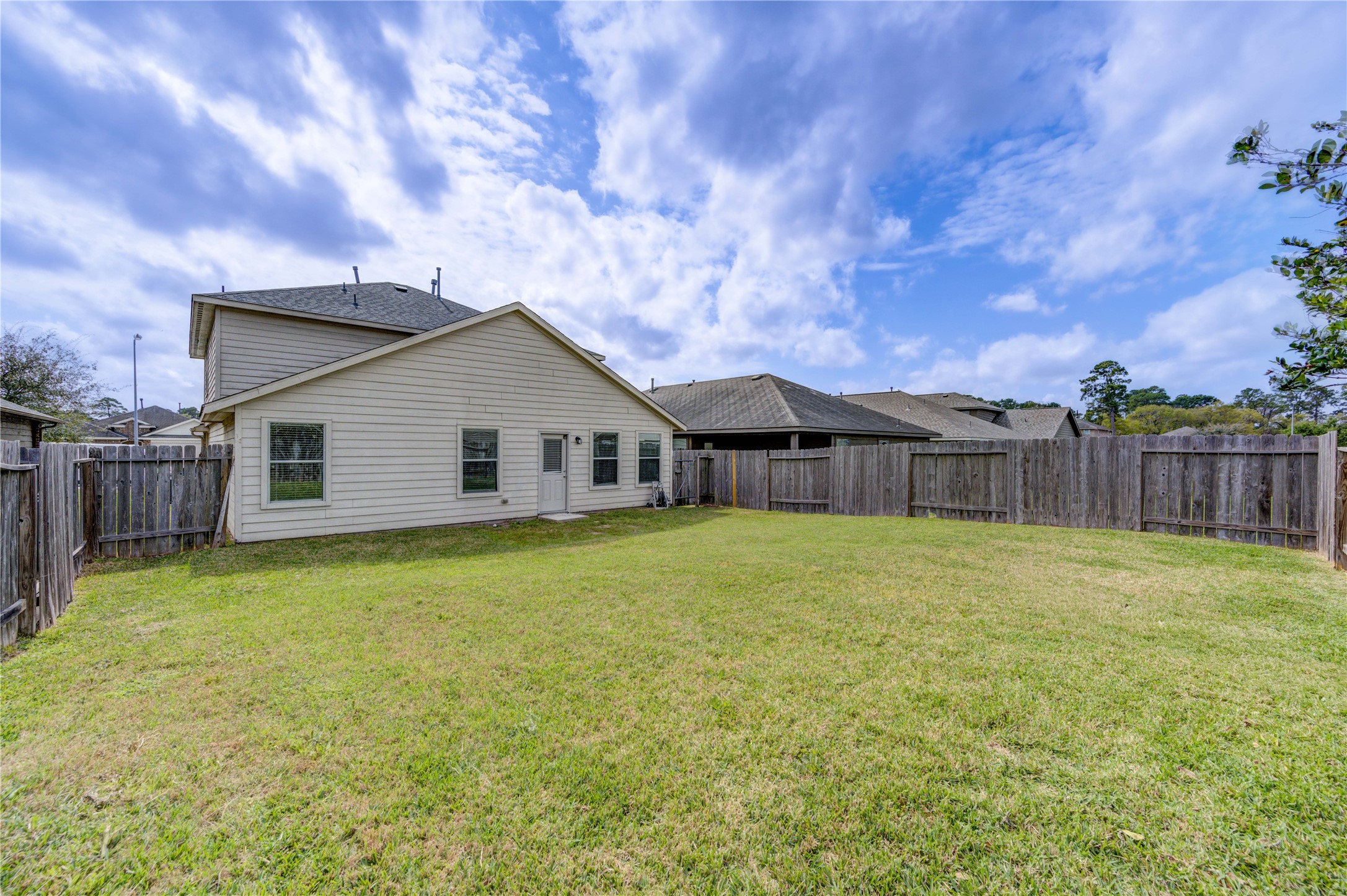 2010 Louetta Stream Way Spring, TX 77388 - Photo 40 of 47 a front view of house with yard and trees in the background