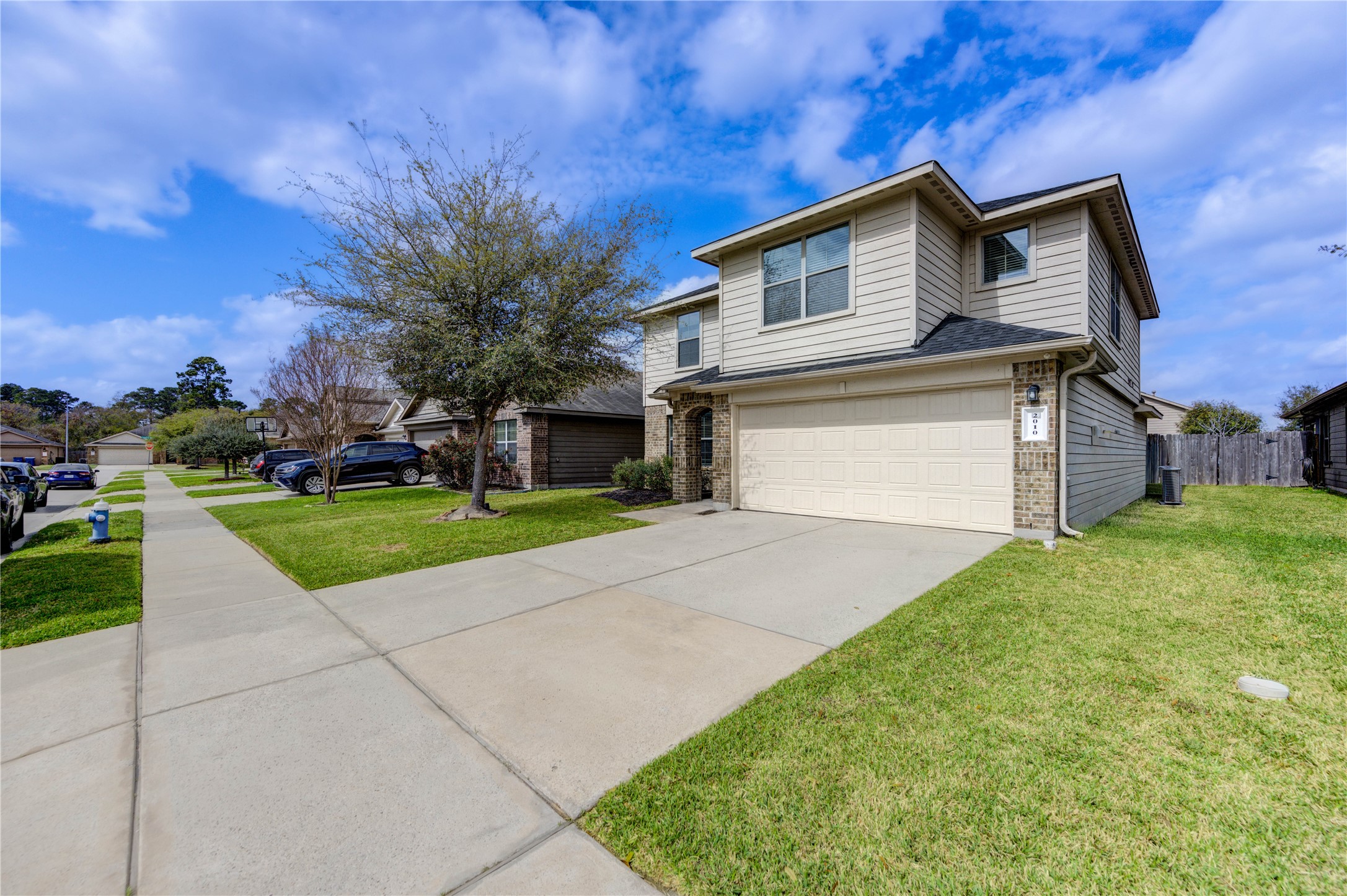 2010 Louetta Stream Way Spring, TX 77388 - Photo 41 of 47 a front view of a house with a yard and garage