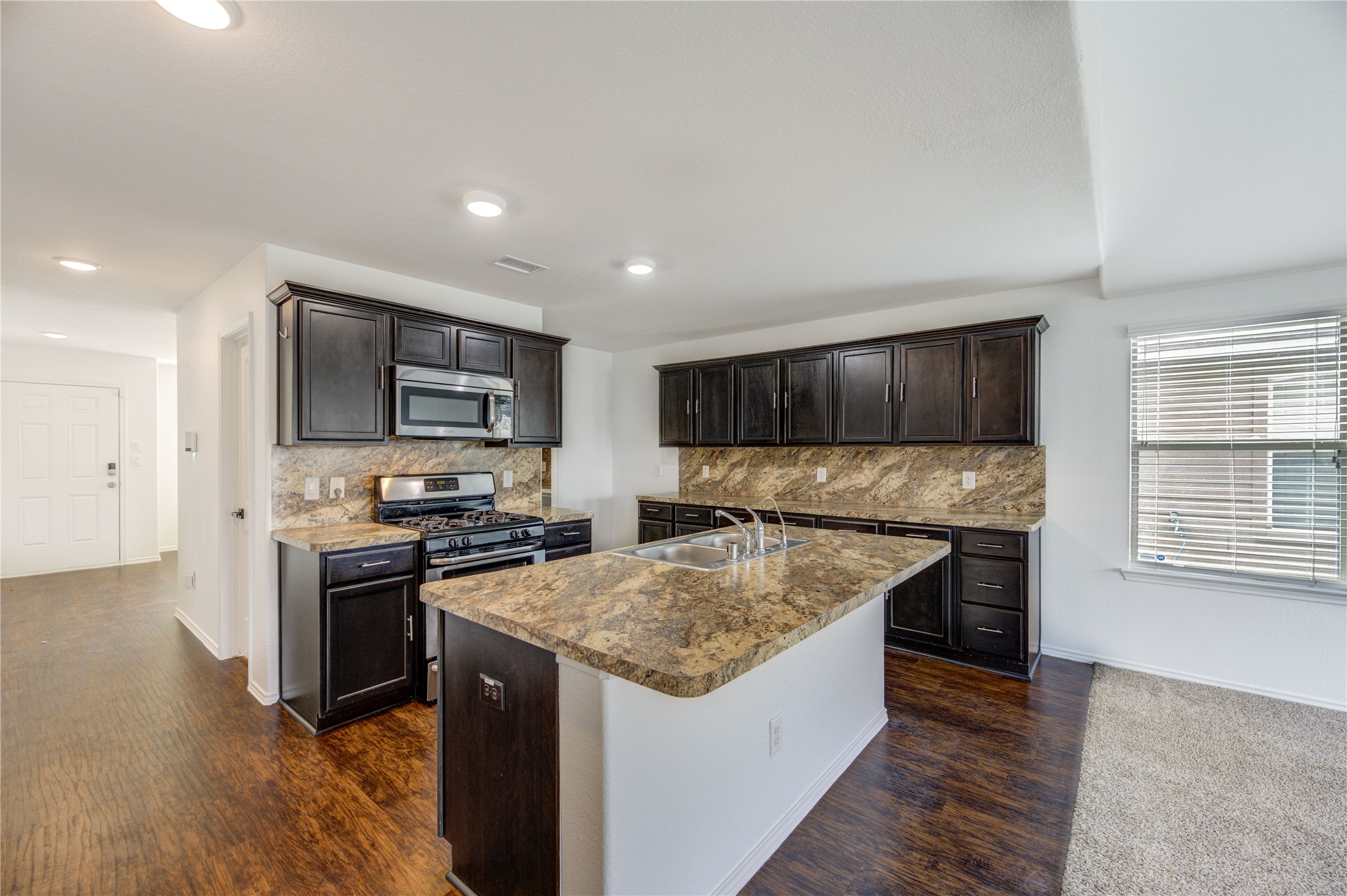 2010 Louetta Stream Way Spring, TX 77388 - Photo 5 of 47 a kitchen with a stove and a refrigerator