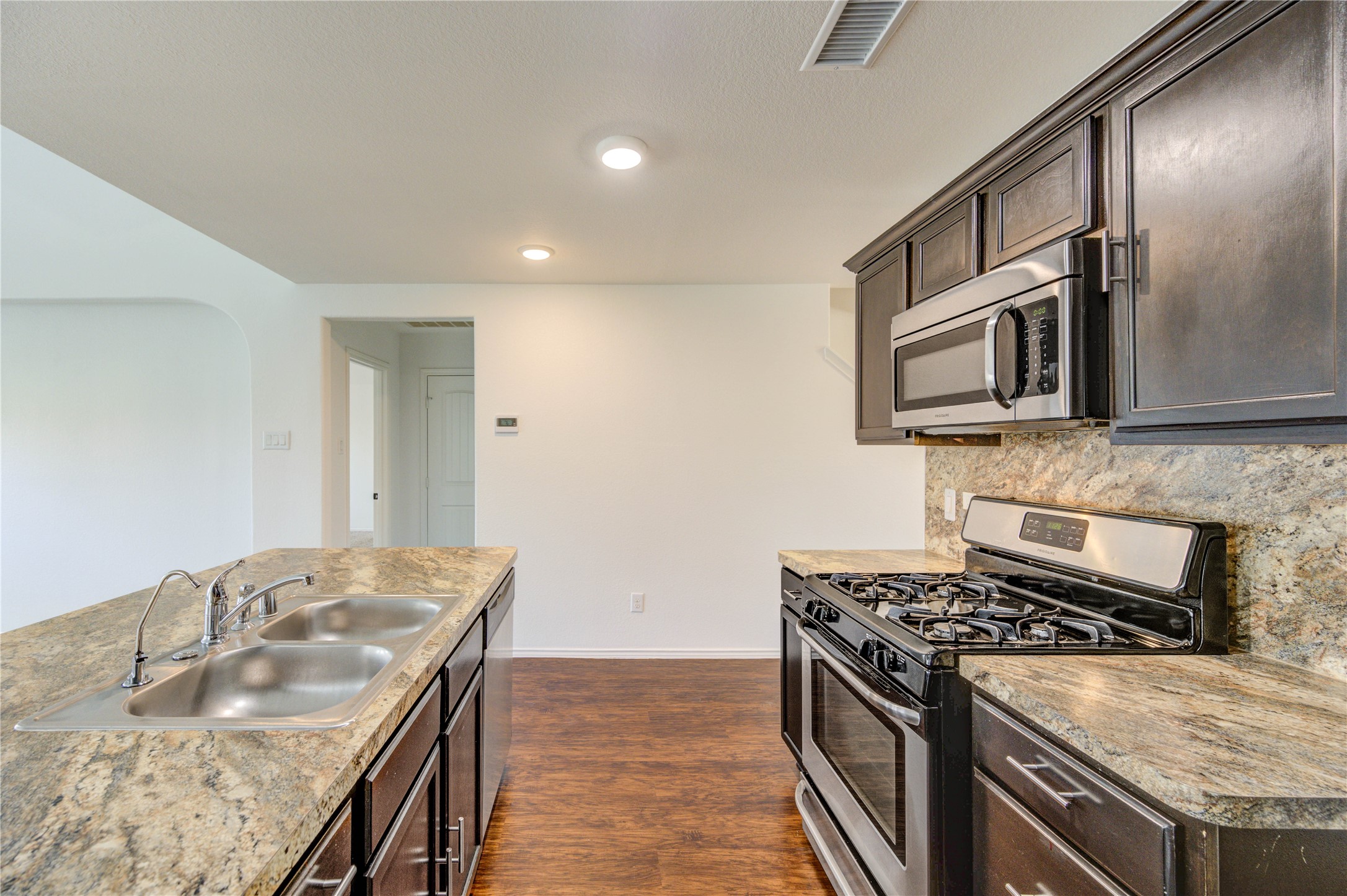 2010 Louetta Stream Way Spring, TX 77388 - Photo 9 of 47 a kitchen that has a sink and a stove