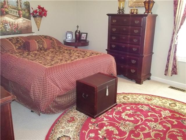 809 Hillside Drive Springfield, TN 37172 - Photo 6 of 16 a bed room with a bed and a dresser
