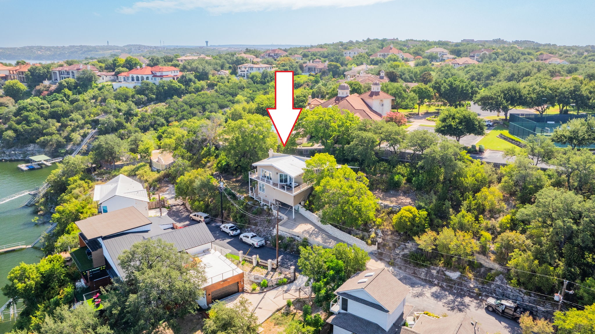 1715 Buffalo Gap Road Austin, TX 78734 - Photo 1 of 18 Elevated lakeside living defines this exceptional property perched above the water.