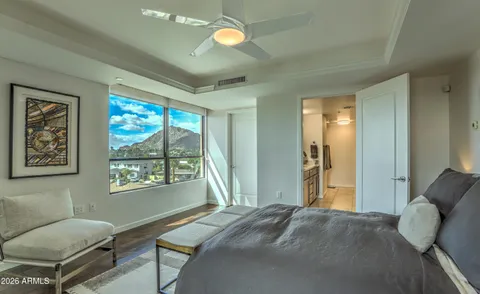 a bedroom with a large bed and a window