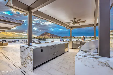 a kitchen with a table and chairs in it