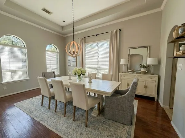 a view of a dining room with furniture and window