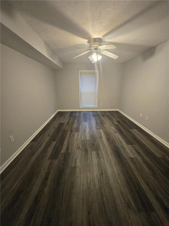 8740 Roswell Road, Unit 2B Atlanta, GA 30350 - Photo 12 of 12 wooden floor in an empty room