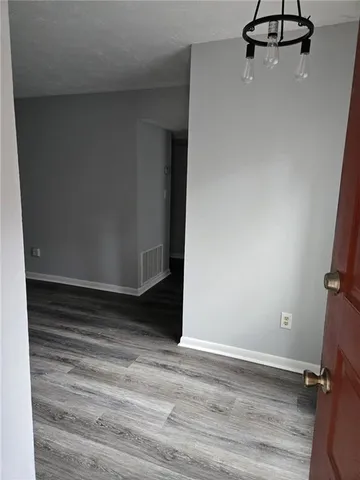 a view of room with hardwood floor