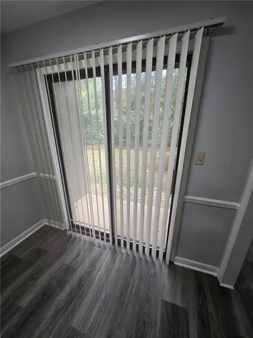 a view of wooden floor with a window