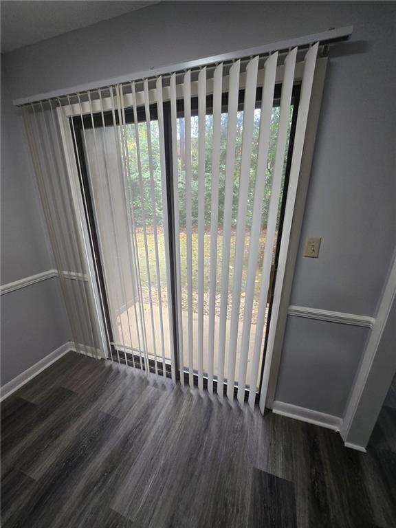 8740 Roswell Road, Unit 2B Atlanta, GA 30350 - Photo 10 of 12 a view of wooden floor with a window