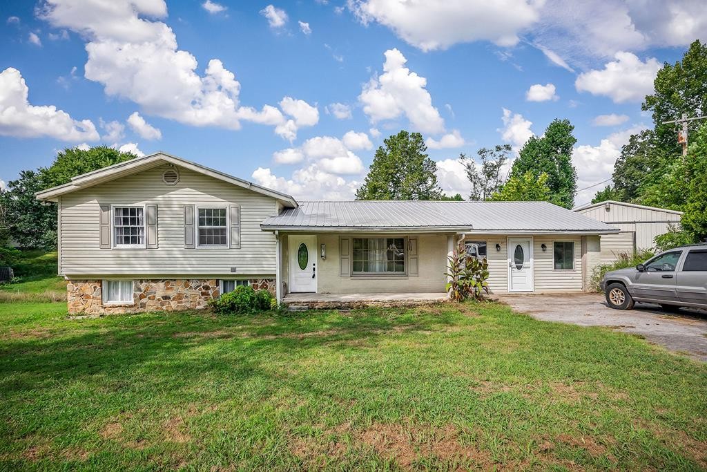 a front view of a house with garden
