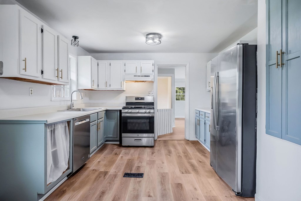 87 Camp Overton Road Rock Island, TN 38581 - Photo 14 of 46 a kitchen with a refrigerator and a stove top oven