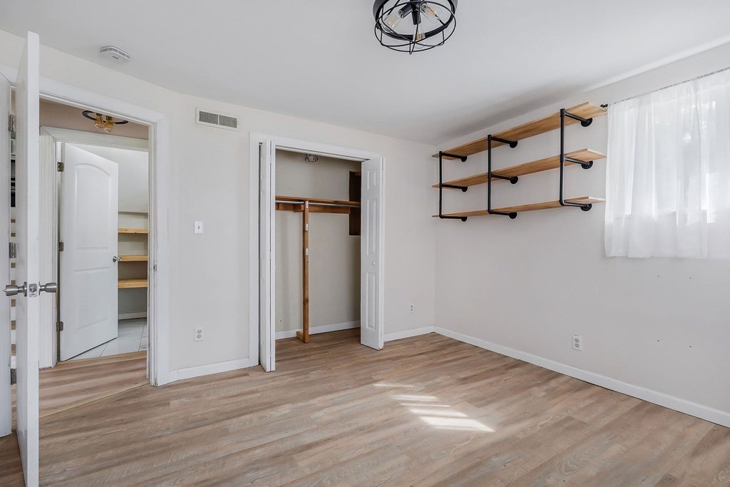87 Camp Overton Road Rock Island, TN 38581 - Photo 21 of 46 a view of an empty room with wooden floor and window