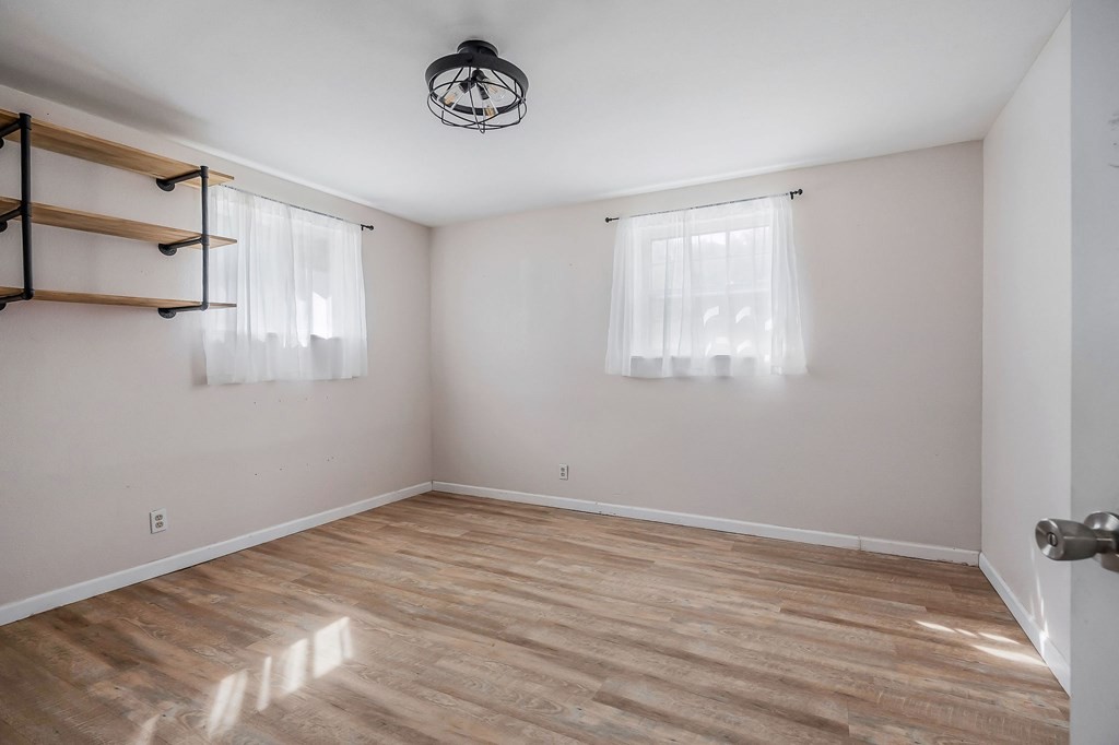 87 Camp Overton Road Rock Island, TN 38581 - Photo 22 of 46 wooden floor in an empty room with a window