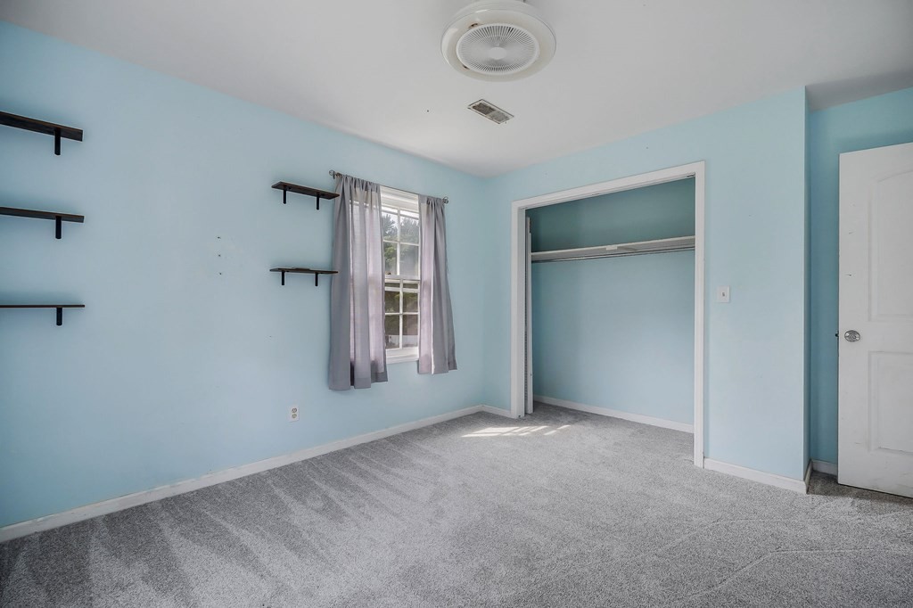 87 Camp Overton Road Rock Island, TN 38581 - Photo 29 of 46 a view of an empty room with closet and a window