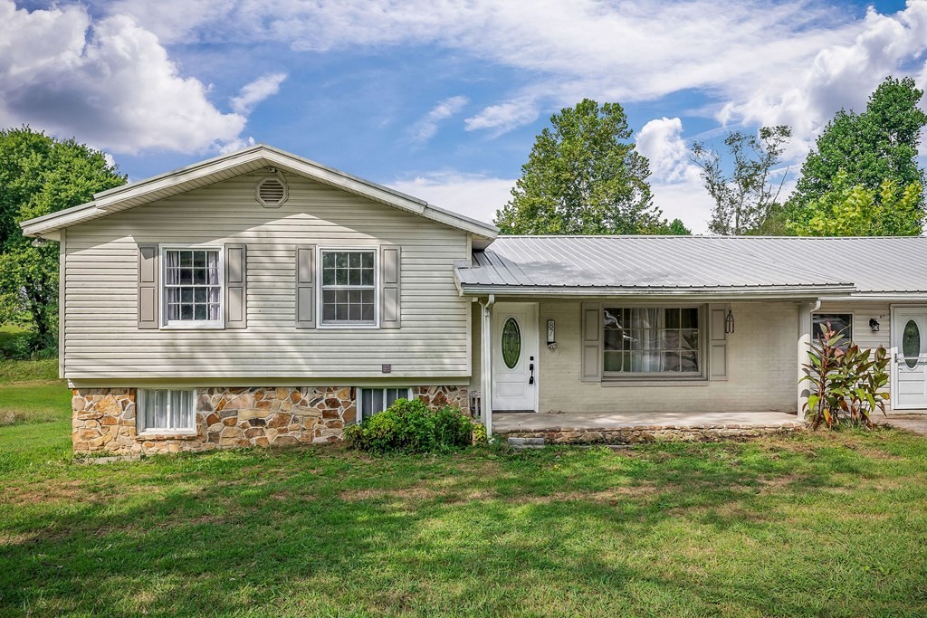 87 Camp Overton Road Rock Island, TN 38581 - Photo 3 of 46 a front view of a house with a yard