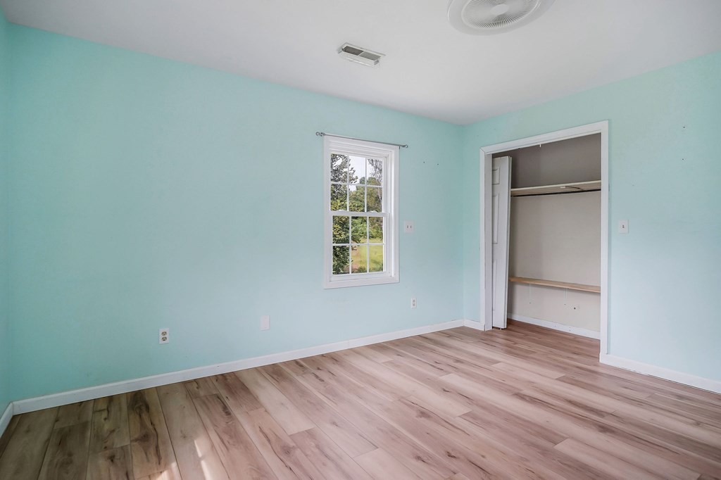 87 Camp Overton Road Rock Island, TN 38581 - Photo 31 of 46 an empty room with wooden floor and windows