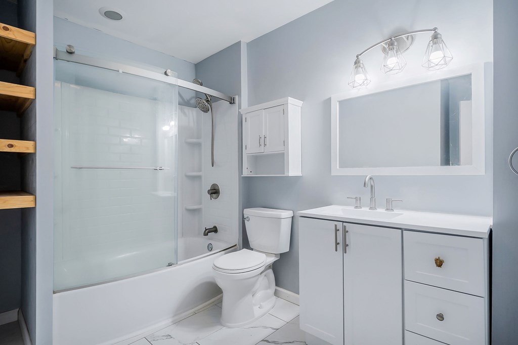 87 Camp Overton Road Rock Island, TN 38581 - Photo 32 of 46 a bathroom with a sink a toilet and shower