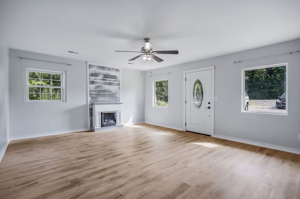 87 Camp Overton Road Rock Island, TN 38581 - Photo 10 of 46 an empty room with windows and fireplace