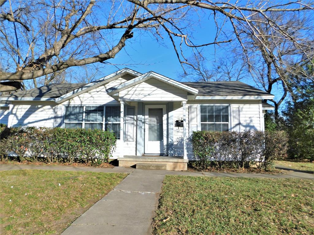 1124 Coit Street Denton, TX 76201 - Photo 1 of 1 a front view of a house with garden