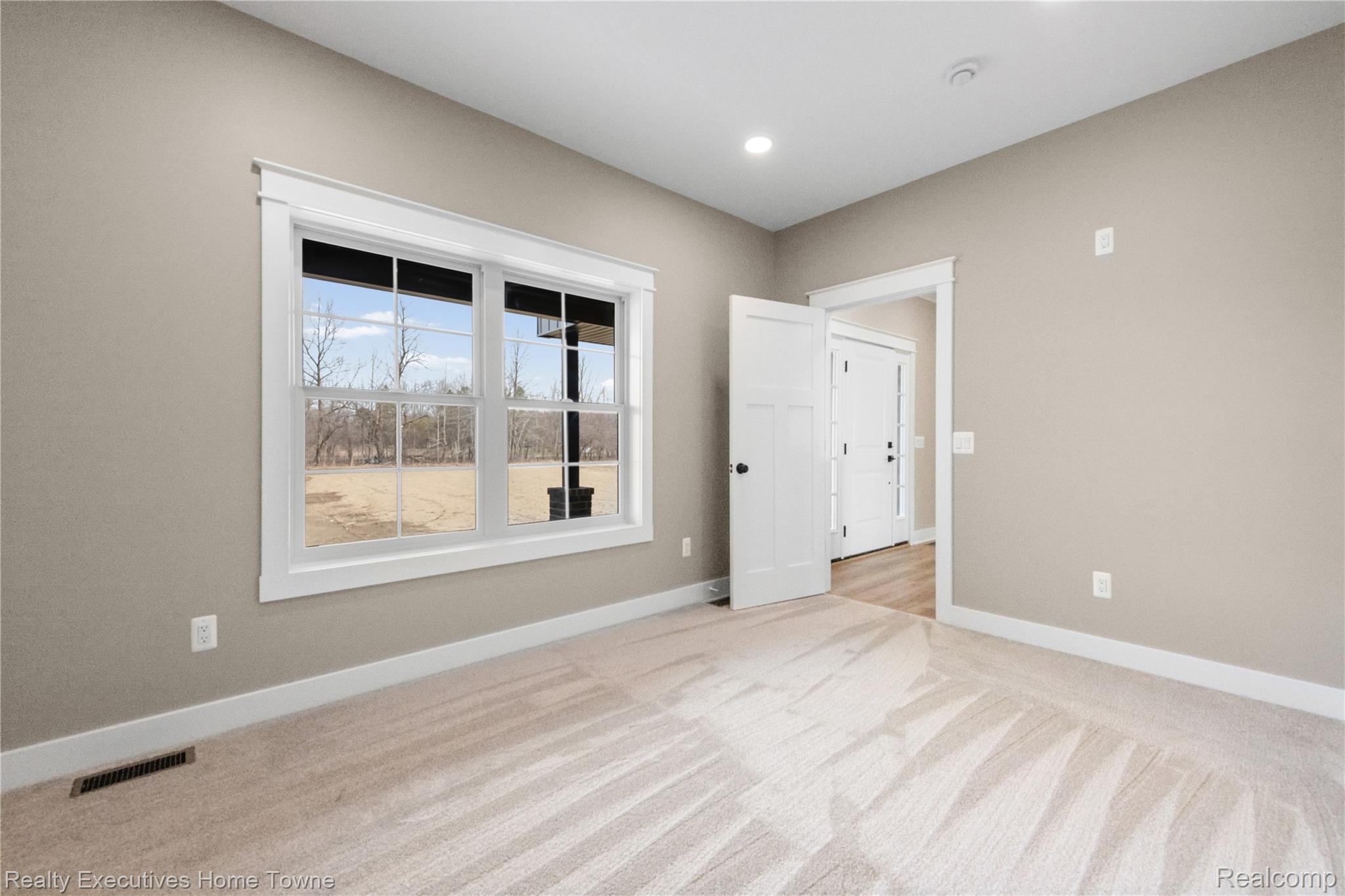 26850 Irwin Road Richmond, MI 48062 - Photo 15 of 47 Spare room featuring light carpet and recessed lighting
