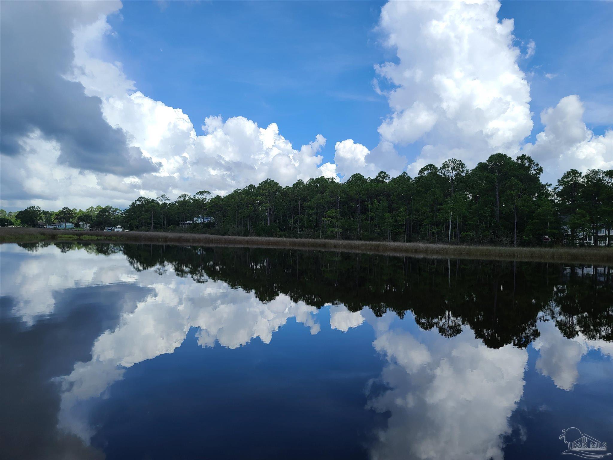 8855 Gerald Road Pensacola, FL 32507 - Photo 30 of 33 a view of a lake in middle of the house