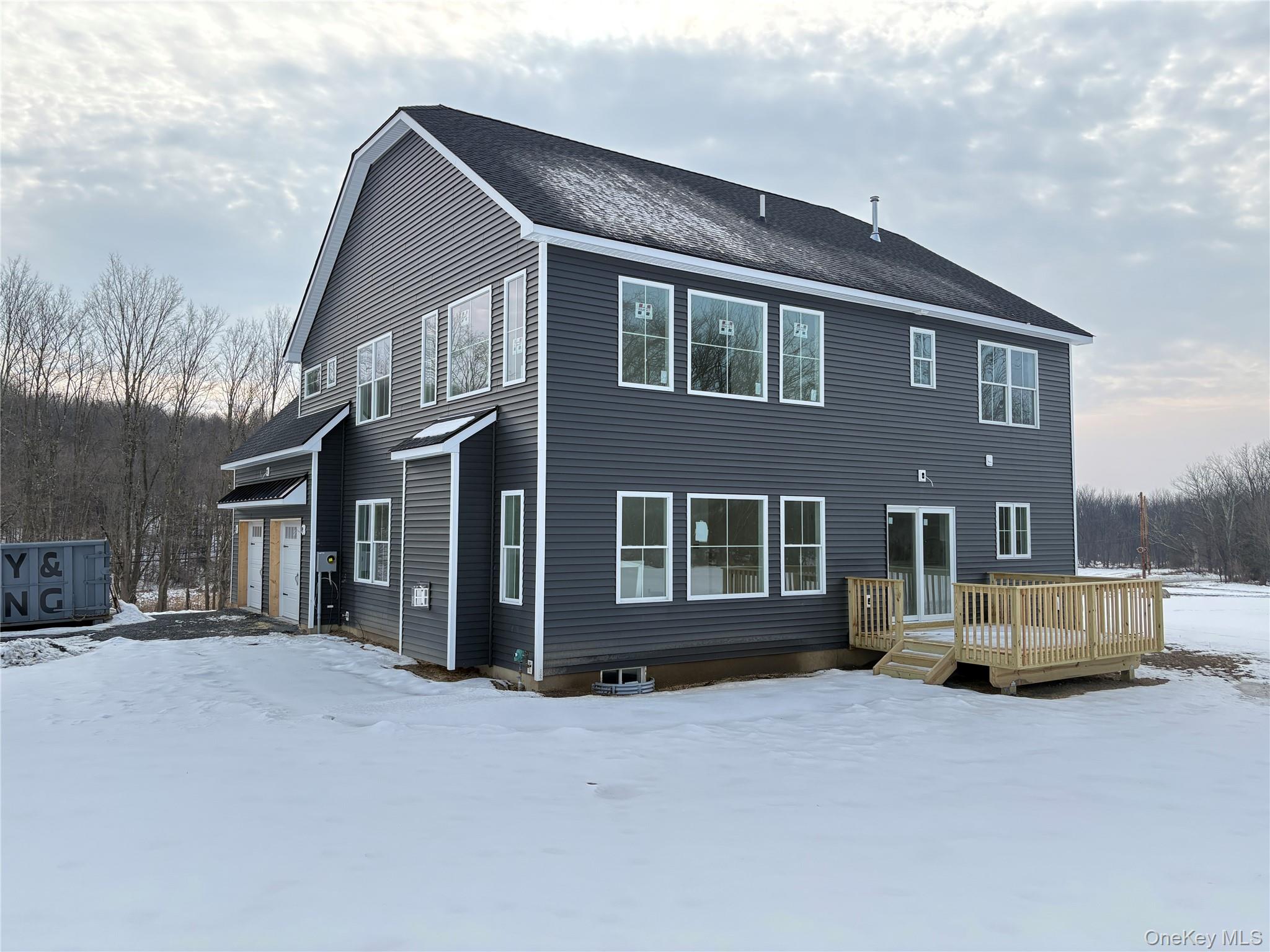 472 Wheeler Road Florida, NY 10921 - Photo 2 of 32 a tall building with a large parking space and parking space