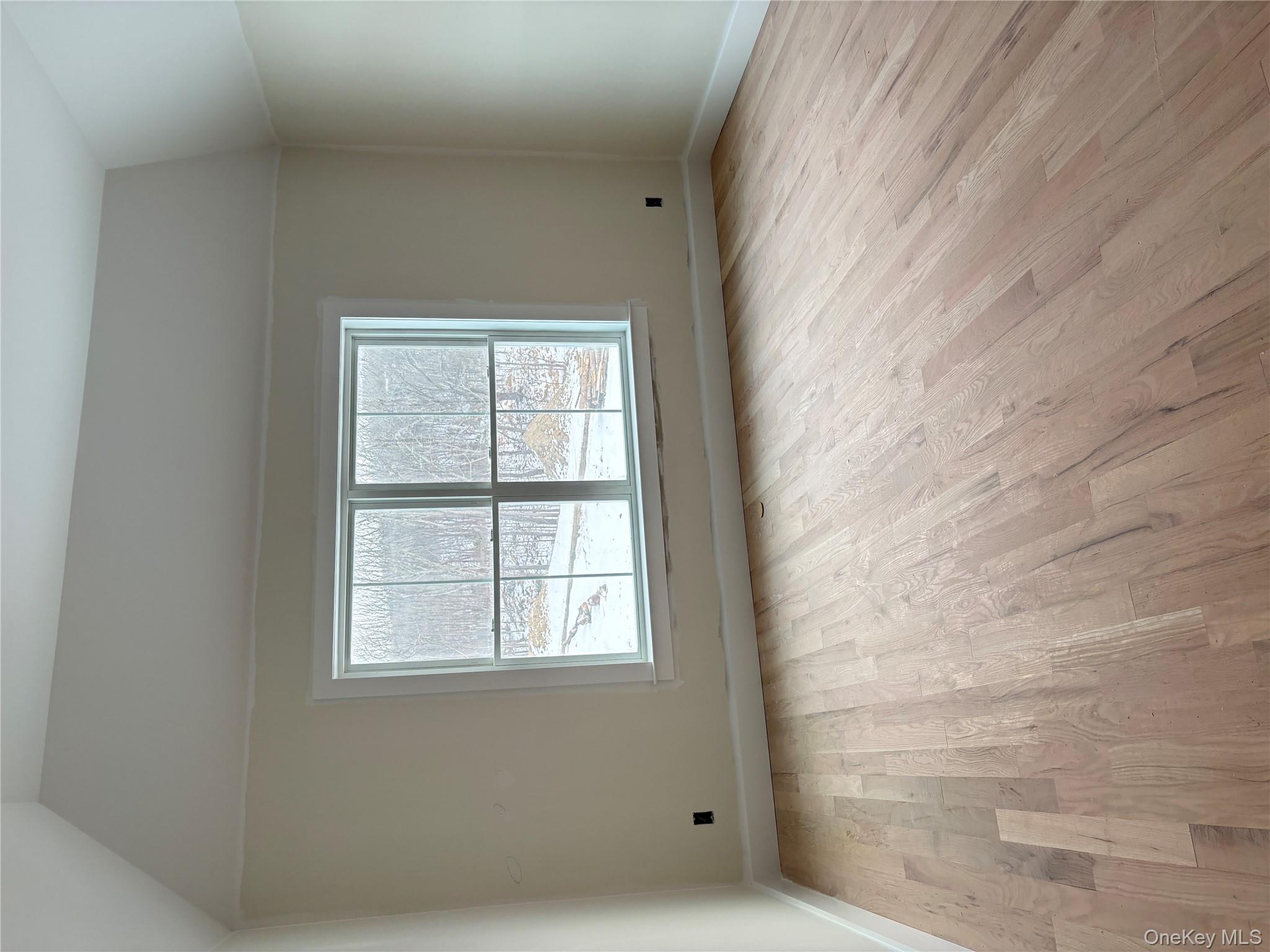 472 Wheeler Road Florida, NY 10921 - Photo 22 of 32 an empty room with wooden floor and windows