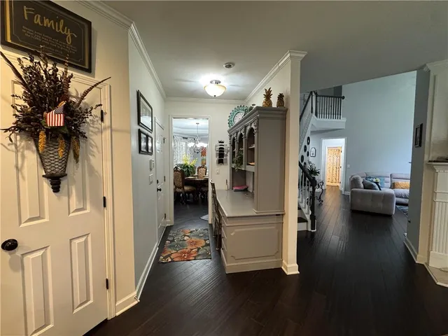 a view of a living room and entryway