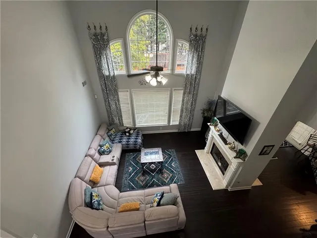 a living room with furniture and a mirror