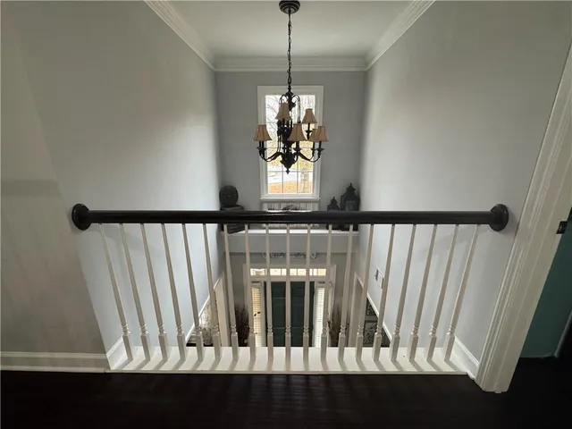 a view of wooden floor and a window