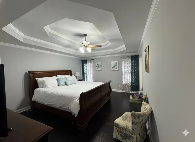 a bedroom with a bed and window