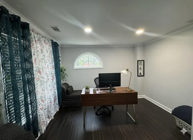 a living room with furniture and a piano