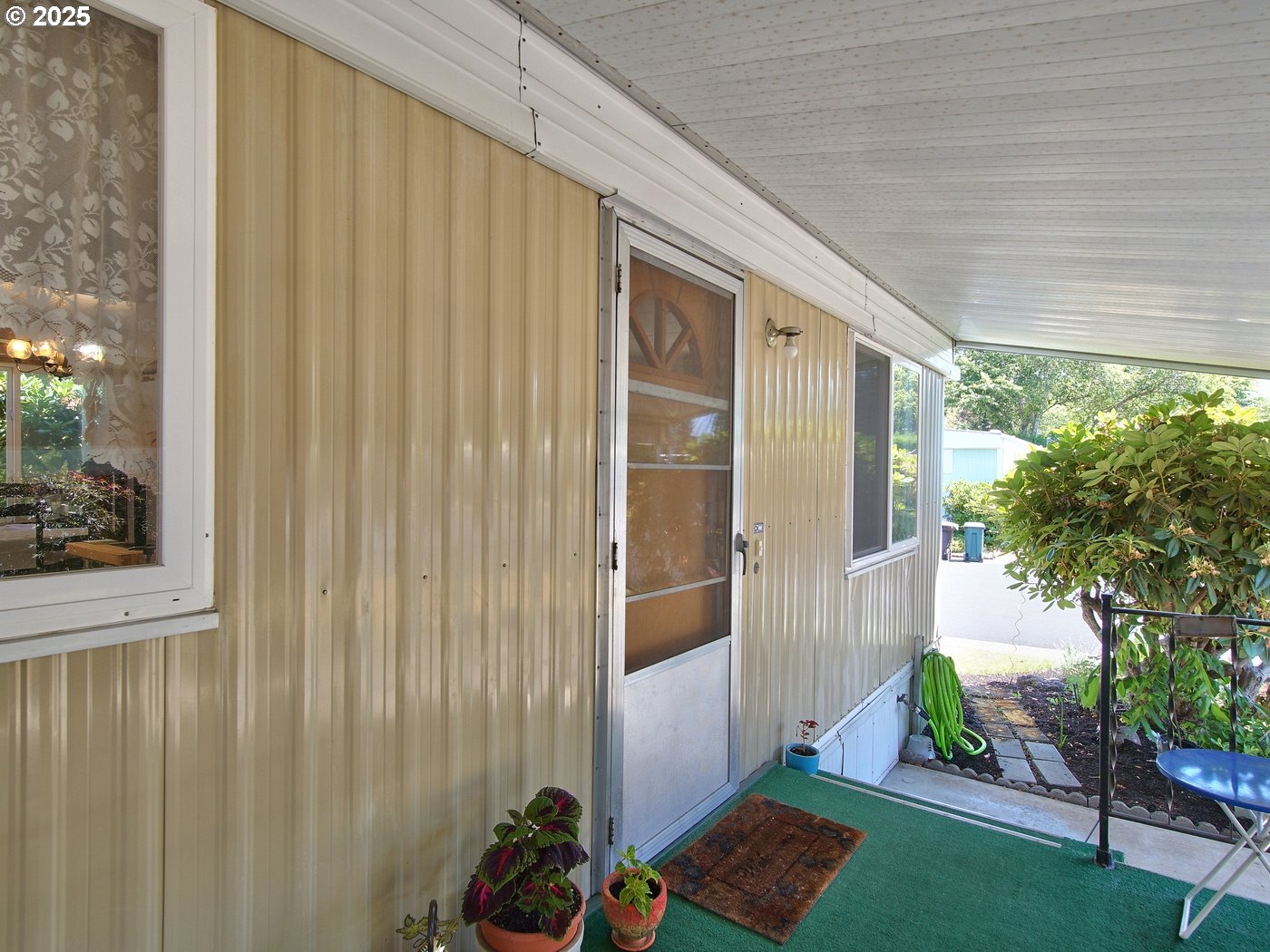 2681 Southeast River Road, Unit 44 Hillsboro, OR 97123 - Photo 13 of 47 a backyard of a house with seating space